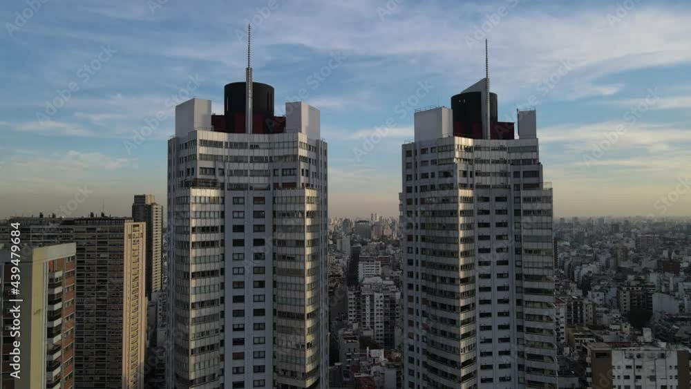 Aerial view of Twin Skyscraper Buildings in Buenos Aires and cityscape in background during golden hour Aerial view of Twin Skyscraper Buildings in Buenos Aires and cityscape in background during golden hour
