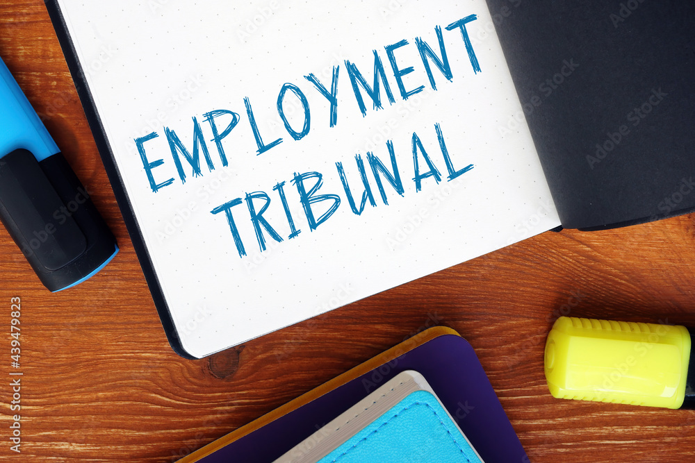Financial concept about EMPLOYMENT TRIBUNAL exclamation marks with sign on the piece of paper. Financial concept about EMPLOYMENT TRIBUNAL exclamation marks with sign on the piece of paper.