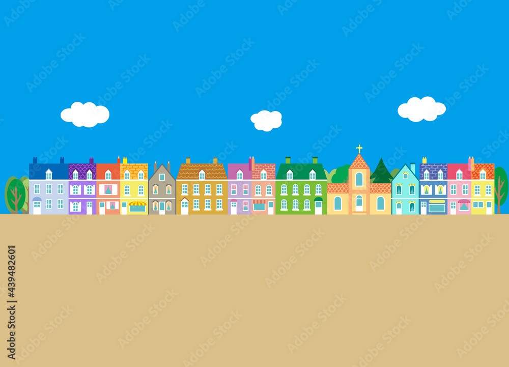 A landscape of colorful European-style houses, a church, and trees