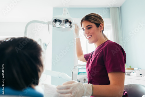 A Female Dentist Checking a Patient 