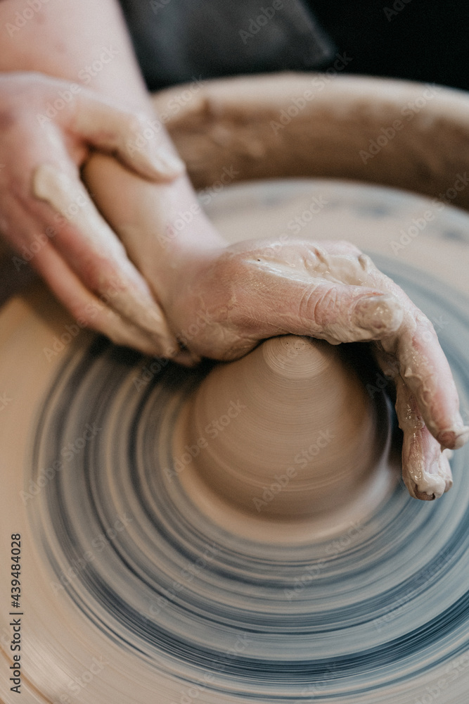 Wetting and shaping Clay on turning weel Wetting and shaping Clay on turning weel