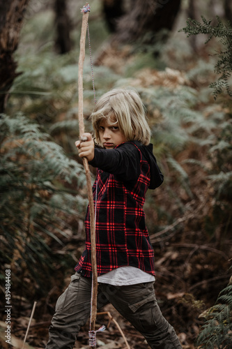 boy bowhunting photo