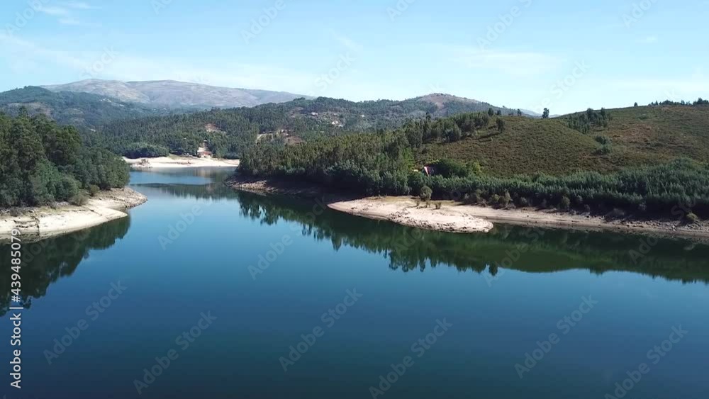 beautiful drone flight over a dam in Portugal, on a clear sunny day beautiful drone flight over a dam in Portugal, on a clear sunny day