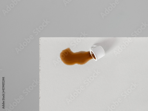 Dropped coffee cup on a white table photo