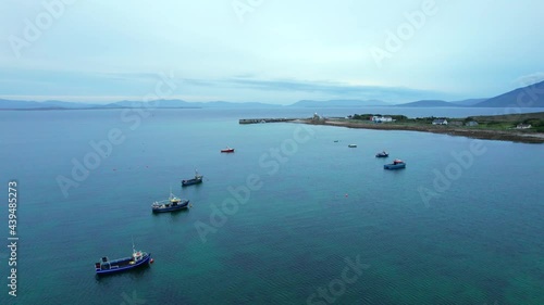 Flying between anchored boats towards Blacksod lighthouse. photo