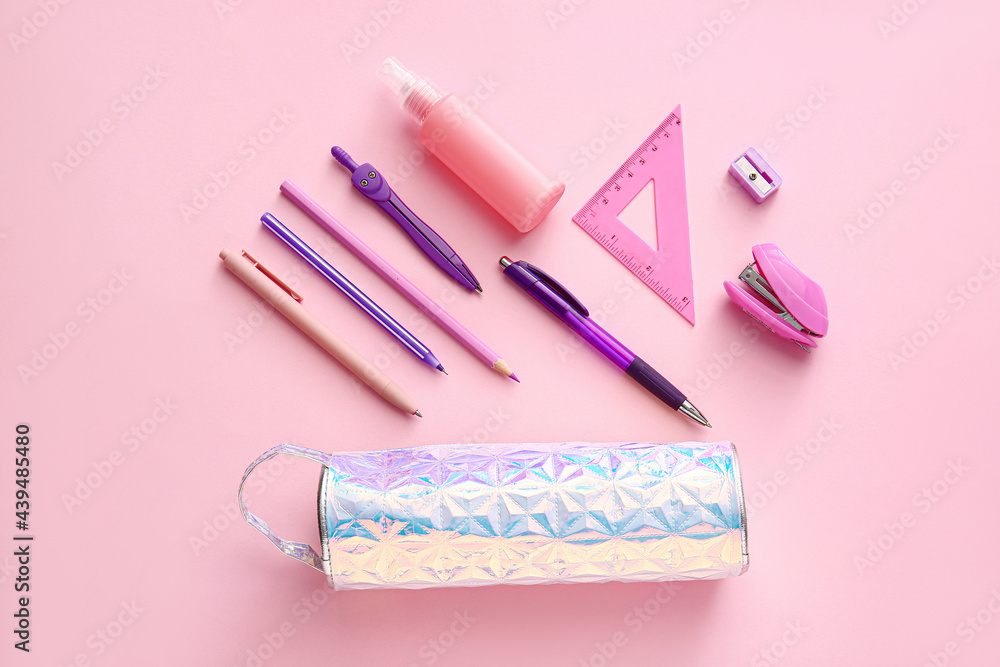 Pencil case with stationery on color background Pencil case with stationery on color background