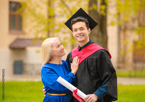 Happy young man with his mo...