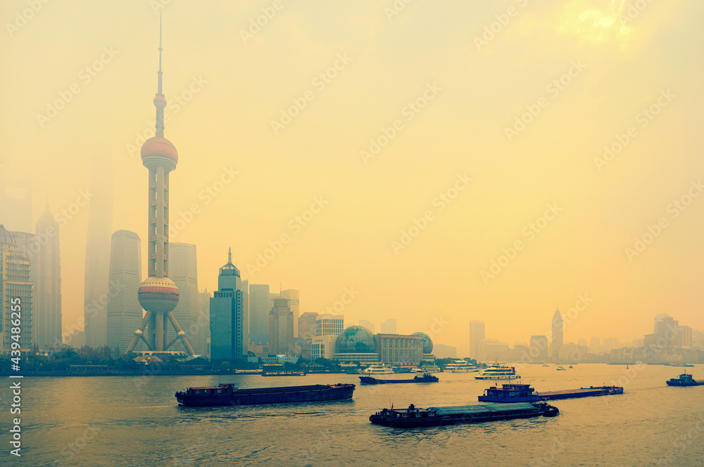 Shanghai skyline in sunny morning with cloud sky, misty and Huangpu river cityscape view Shanghai skyline in sunny morning with cloud sky, misty and Huangpu river cityscape view