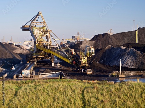 Fossil fuel carbon economy, piles of coal for energy production photo