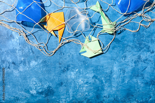 Net with paper fishes and g...