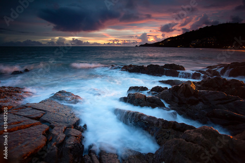 Long exposure image of Dramatic sky seascape with rock in sunset scenery background ,Puket Thailand 
