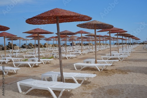 Beach with umbrellas on the shores of the Black Sea.  The ideal place to relax and spend wonderful moments.
