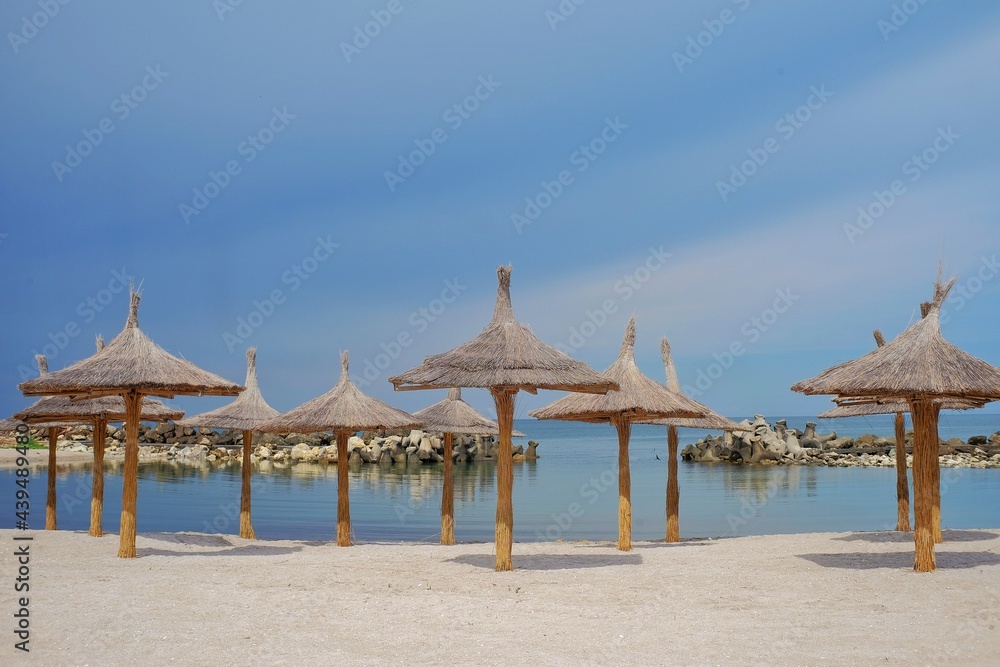 Beach with umbrellas on the shores of the Black Sea.  The ideal place to relax and spend wonderful moments.