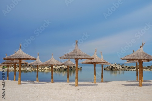 Beach with umbrellas on the shores of the Black Sea.  The ideal place to relax and spend wonderful moments.