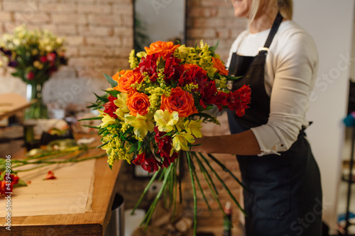 A Photo of A Woman Arranging A Bouquet  photo