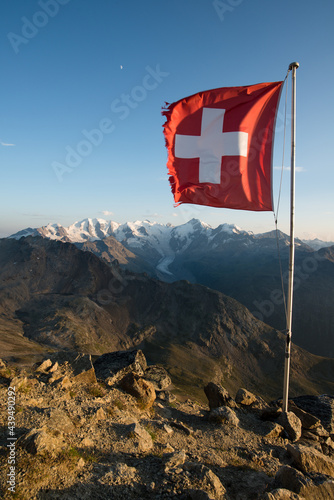 Bernina mountain range with swiss flag photo