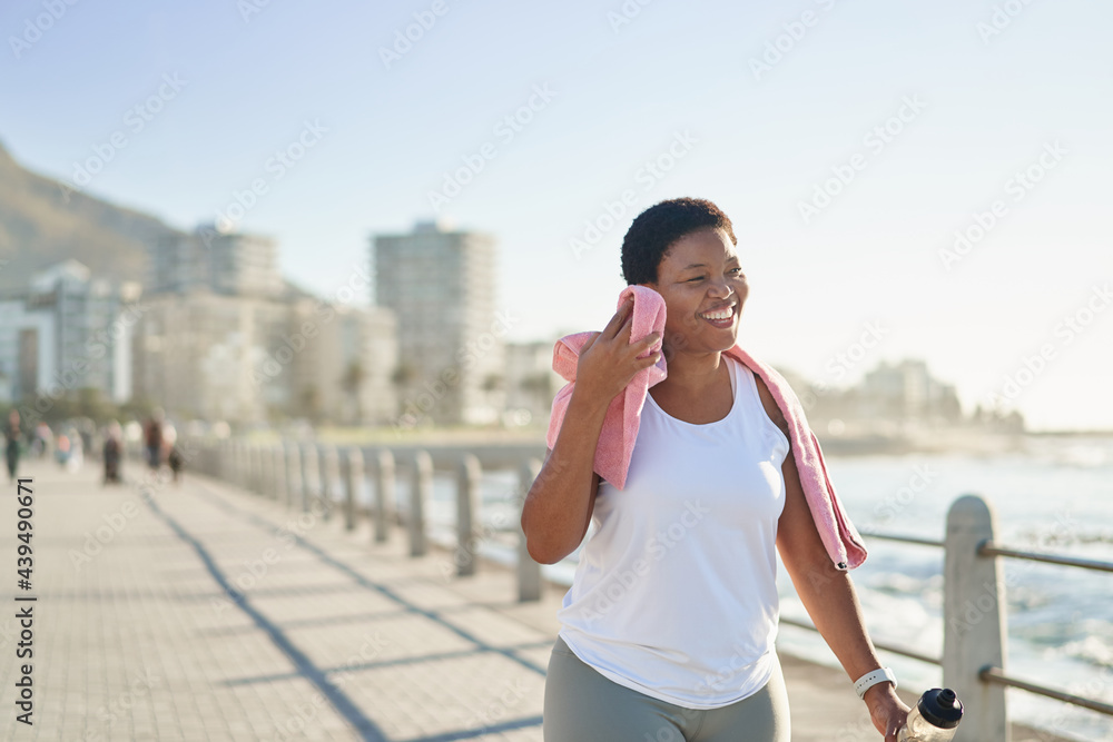 After workout woman wipes sweat with towel After workout woman wipes sweat with towel