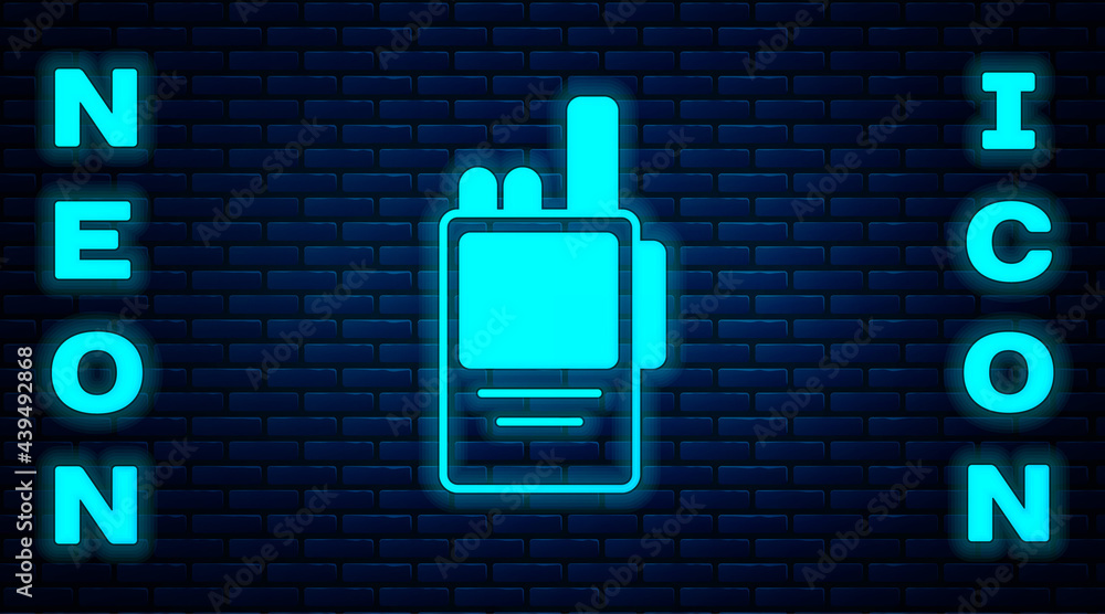 Glowing neon Walkie talkie icon isolated on brick wall background. Portable radio transmitter icon. Radio transceiver sign. Vector Glowing neon Walkie talkie icon isolated on brick wall background. Portable radio transmitter icon. Radio transceiver sign. Vector