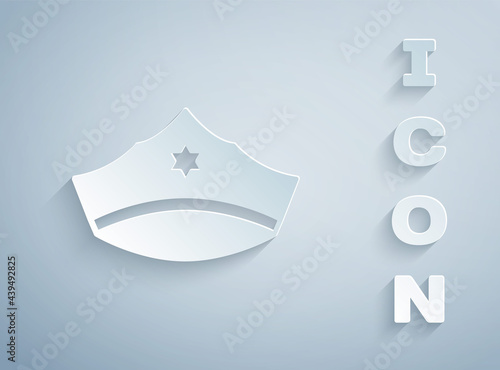 Paper cut Police cap with cockade icon isolated on grey background. Police hat sign. Paper art style. Vector