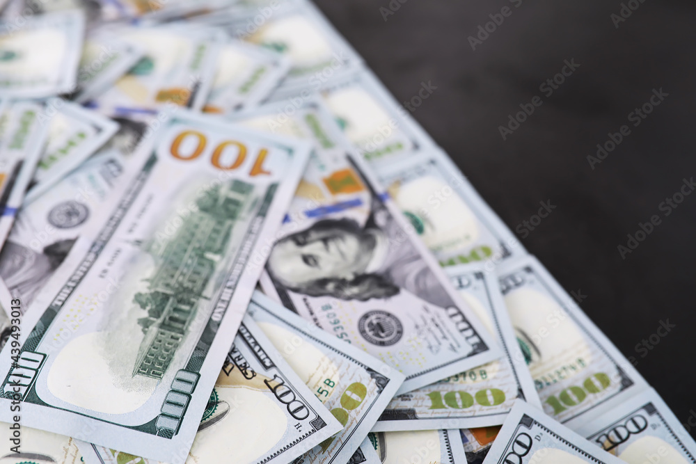 Group of money stack of 100 US dollars banknotes a lot of the background texture. Cash money in a large pile as a finance background. Group of money stack of 100 US dollars banknotes a lot of the background texture. Cash money in a large pile as a finance background.