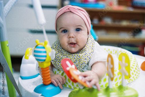 baby girl in bouncer