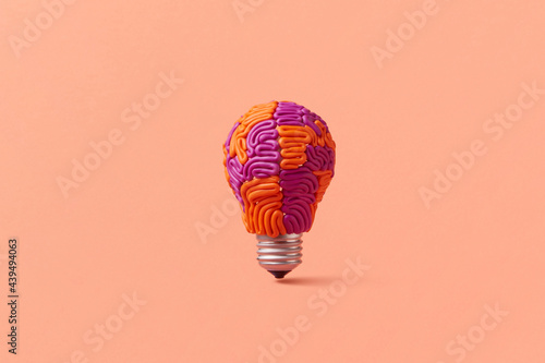 One light bulb in shape of brain photo