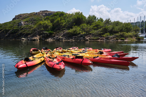 Fotografija Many bright canoes floating on sea water