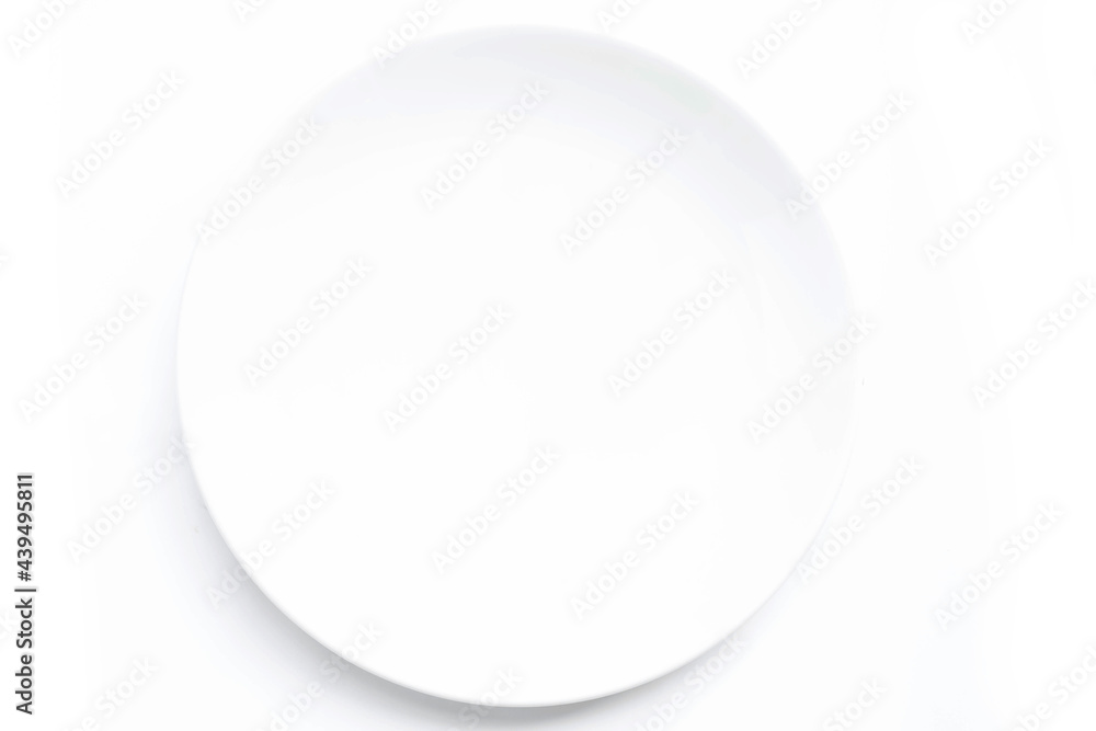 White ceramic plate on a white table. For food, advertising space.