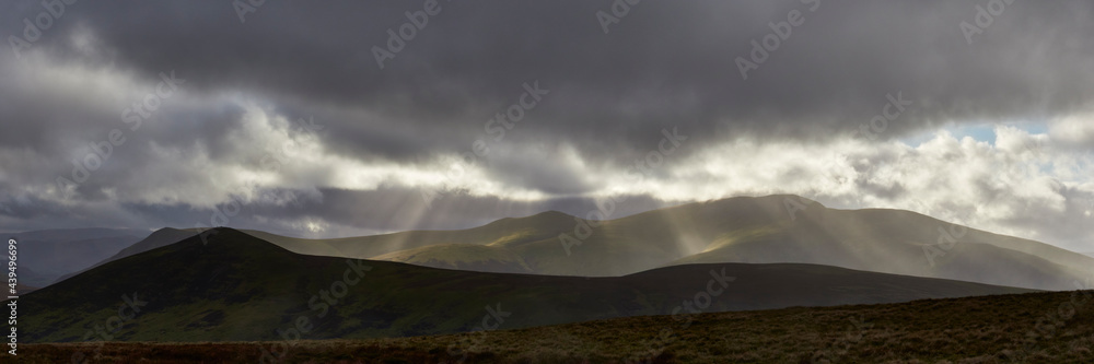 Rain and sunlight over Skiddaw. Lake District, Cumbria, UK. Rain and sunlight over Skiddaw. Lake District, Cumbria, UK.