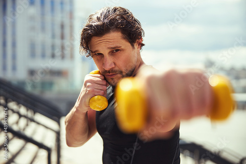 Portrait of serious man looking at camera