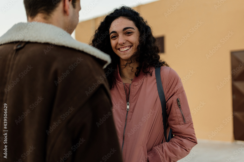 Close-up of a young girl smiling at her boyfriend Close-up of a young girl smiling at her boyfriend