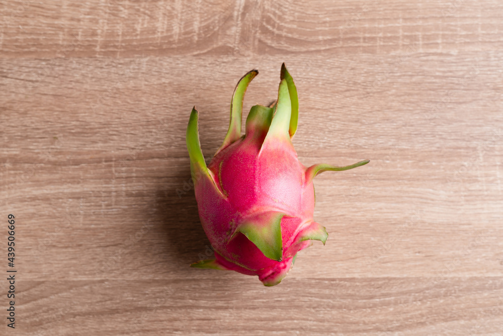 Dragon fruit or pitaya on wooden background, Tropical fruit, Table top view