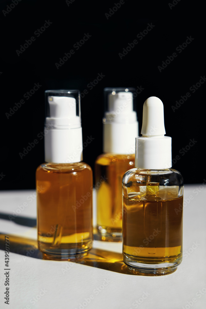 CBD Oil Bottles in Harsh Sunlight CBD Oil Bottles in Harsh Sunlight