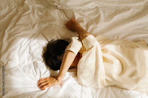 woman lying on bed photo