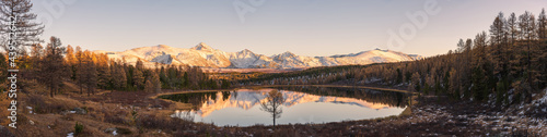 Autumn lakes  coniferous forests  snow-capped mountains. Panorama of the Altai Mountains in Russia.