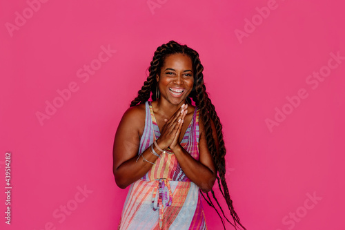 Joyous Black woman with long twisted hair photo