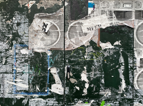 wall with torn posters