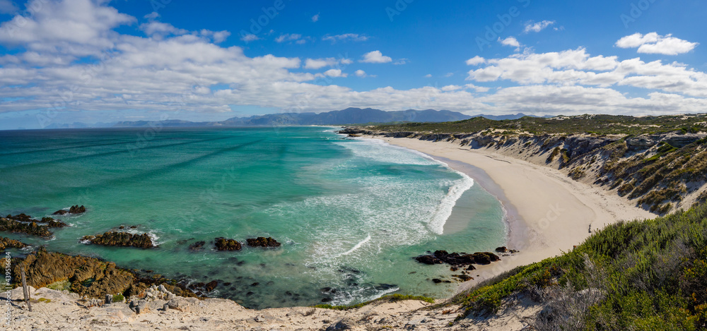 Wonderful elevated views of the Walker Bay Nature Reserve coastline with the Kleinrivier mountains in the far distance. De Kelders near Gansbaai. Overberg. Western Cape. South Africa.
