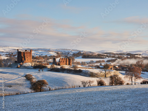 Brough Castle and snow at sunrise. Church Borugh, Cumbria, UK. photo