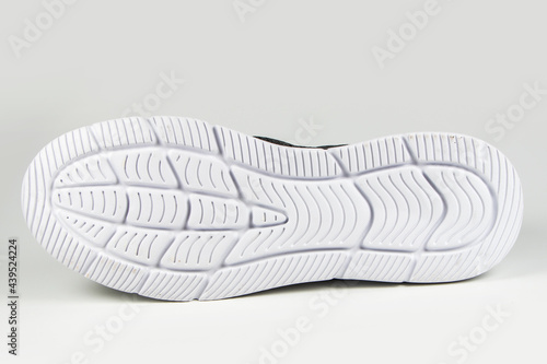 Foto Sole of sport shoe on white background