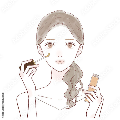 コンシーラーを持っている女性