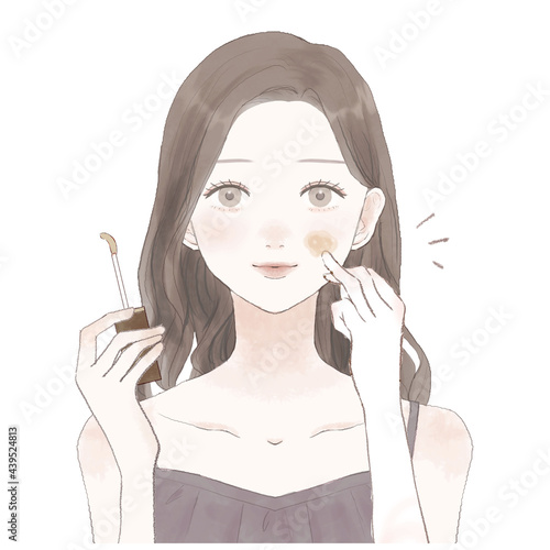 コンシーラーを顔に塗っている女性
