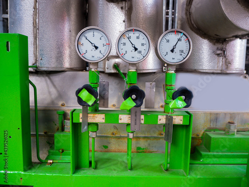 Pressure gauge of measuring instrument close up in industry zone at power plant.