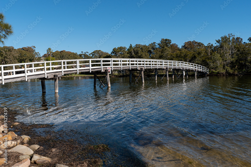 old wooden pedestrian bridge at the entrance