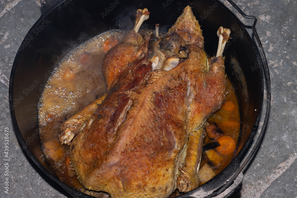 Crispy roasted stuffed duck in the dutch oven. Crispy roasted stuffed duck in the dutch oven.