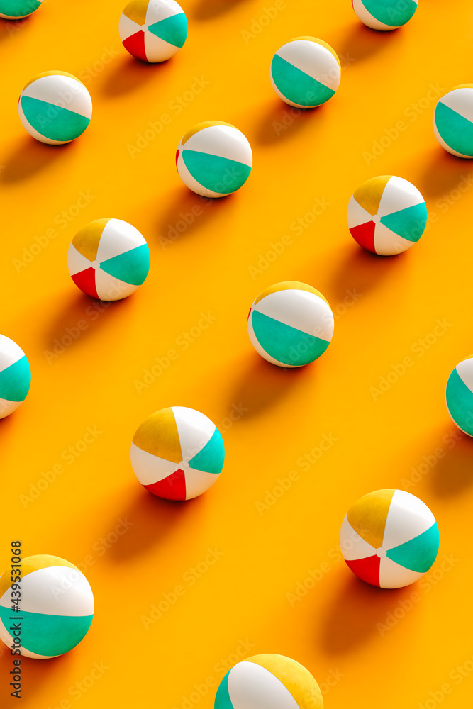 Beach balls on orange - vertical image Beach balls on orange - vertical image