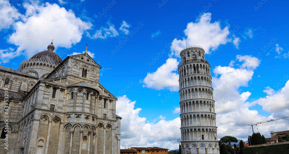 Beautiful view with cloudy and blue sky which Tourists visiting the leaning tower of Pisa , Italy