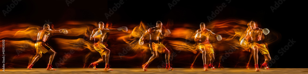 Fototapeta premium Professional african-american boxer training on black studio background in mixed light. with strobe, reflection, mirror effect. Collage.