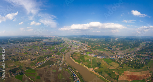 Beautiful sky, blue sky and white clouds. Green rice fields near the city of Shanghai, on the plain of the Yangtze River valley in China. Pictures of agricultural production and environmental protecti