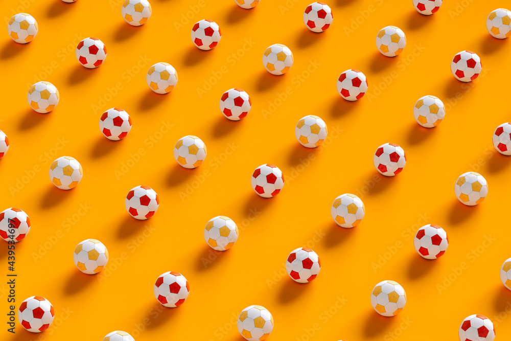 Soccer balls on orange background Soccer balls on orange background